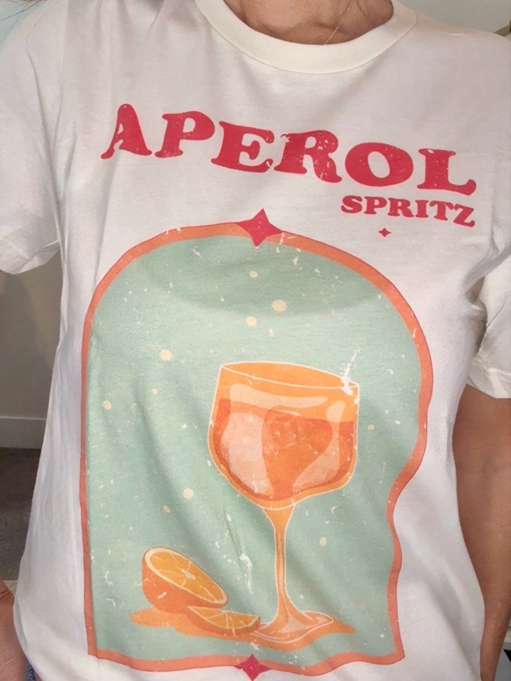 Aperol Cream Tee with Distressed Red Graphic